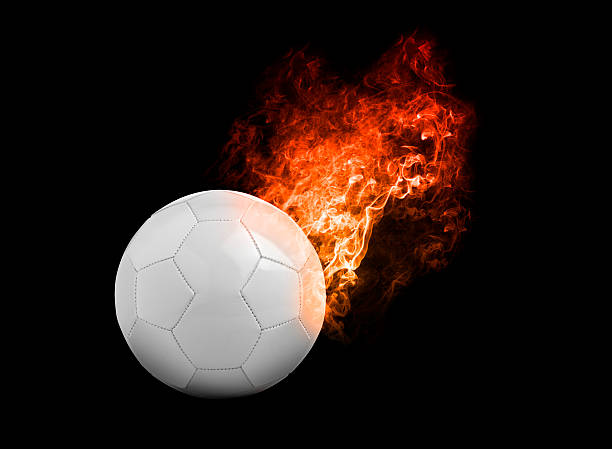 istock Flaming Football Ball on black background 525215896