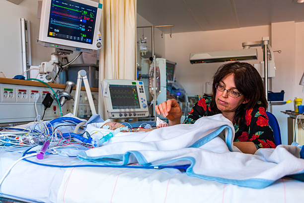 Intensive care mother and child. stock photo