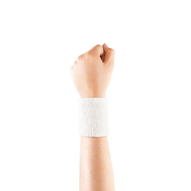 Blank white wristband mockup on hand, isolated. Clear sweat band mock up design. Sport sweatband template wear on wrist arm. Sports support protective bandage wrap. Bangle on the tennis player hand.