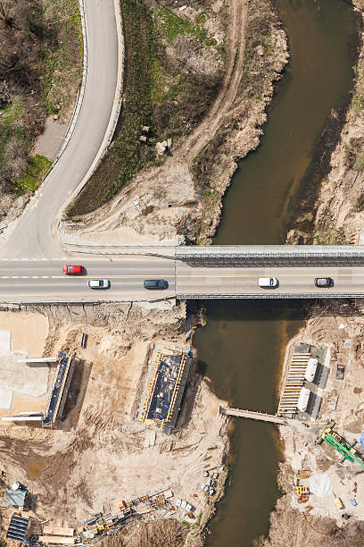 istock aerial view of the  river and bridge building site 525217736