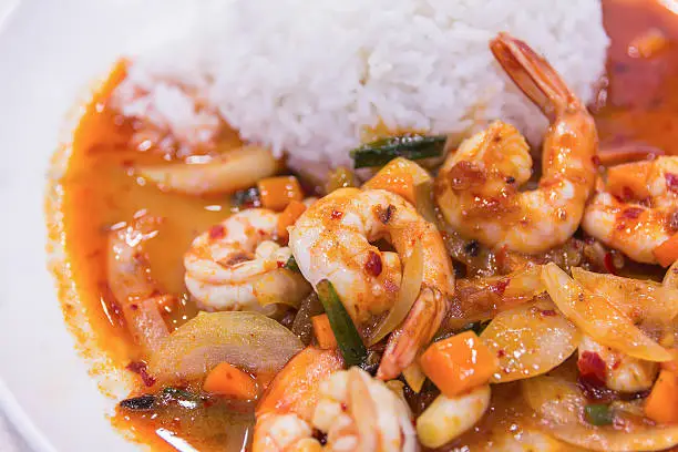 Photo of stir fried shrimp in thai red curry paste