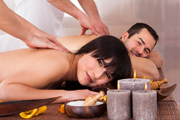 istock Beautiful Young Couple Enjoying Massage 525218629