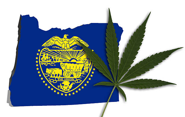 Oregon map with marijuana leaf stock photo