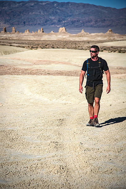 istock Man Hiking in Solitude in the Mojave Desert 525219218