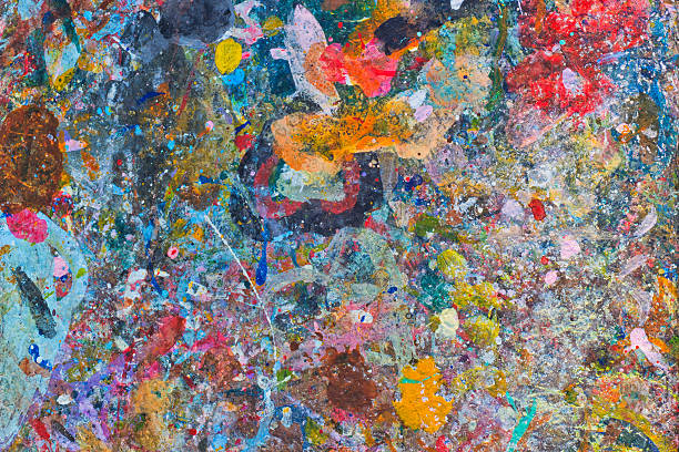 istock Abstract colorful texture background. Splash acrylic color on wood table. 525219648