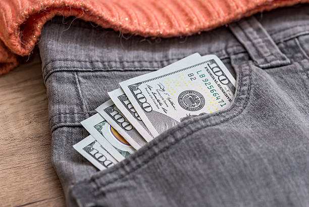 istock euro dollars in the grey jeans pocket 525219706