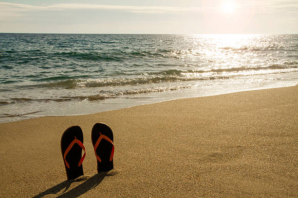 istock Flip flop at the seaside - Stock Image 525219964