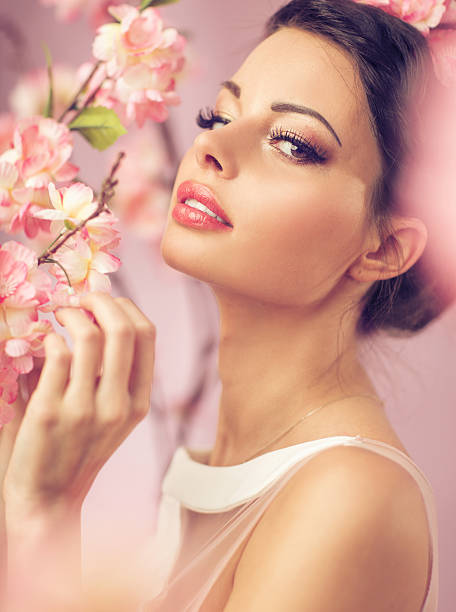 istock Brunette beautie with the flowers 525220229