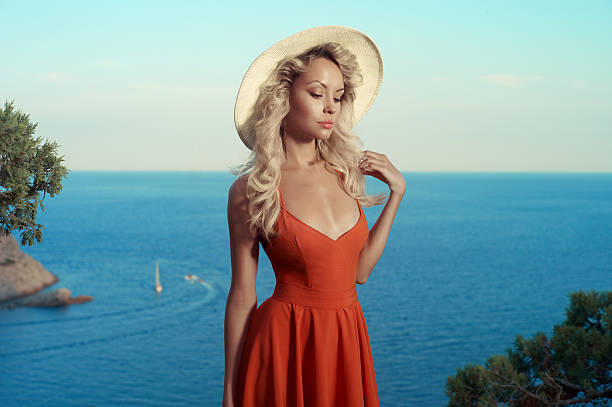 istock Beautiful blonde at the sea 525220779