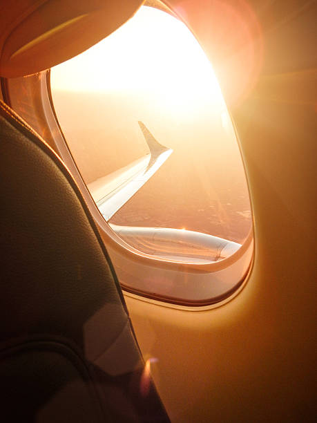 istock Sunlight from the porthole on airplane 525221631