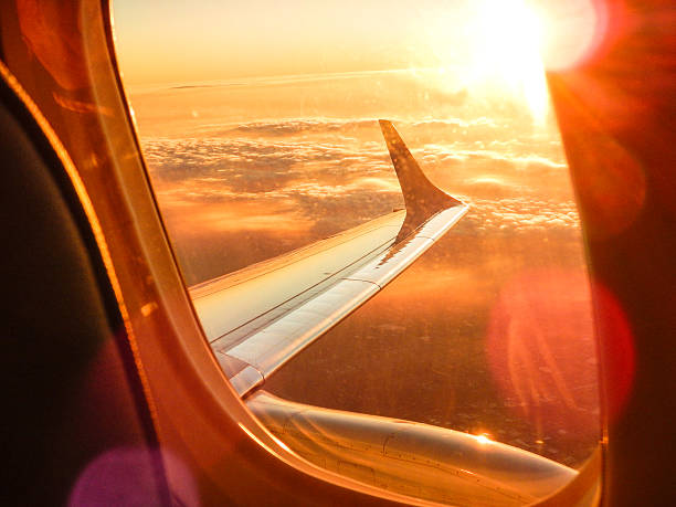 istock Sunlight from the porthole on airplane 525221639