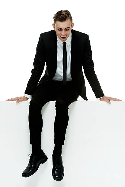 istock Cheerful businessman on box & looking down 525222435
