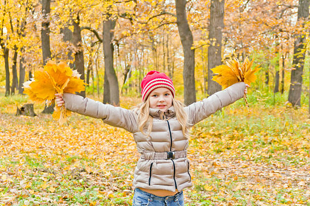 istock Cute dancing girl in autumn 525223161