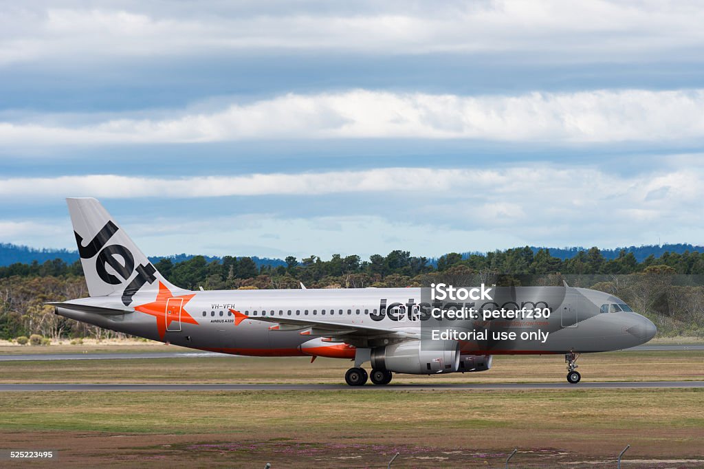 Jetstar Austrália passageiro Avião pousando - Foto de stock de Aeroporto royalty-free