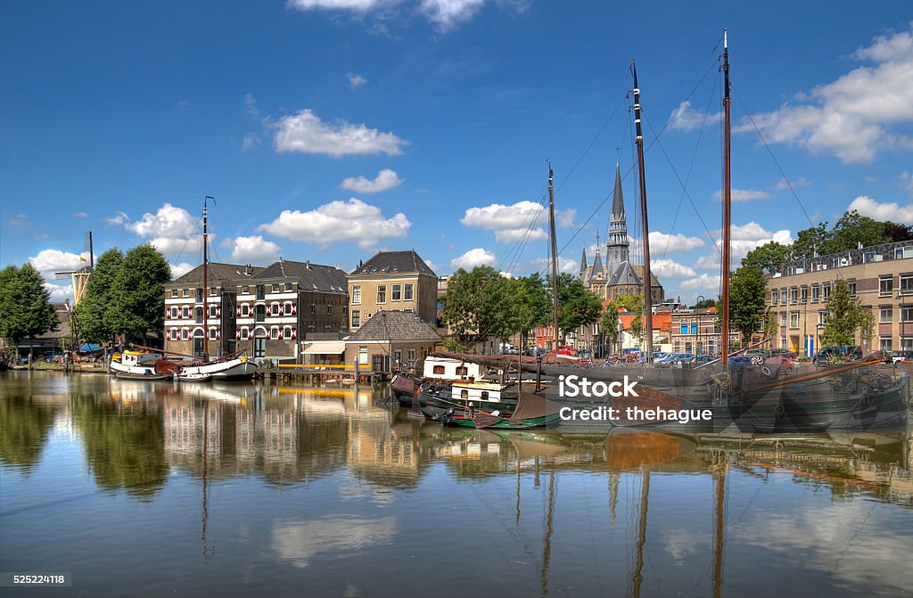 Haven van Gouda Historical boats and warehousesl on a canal in the Dutch town Gouda, Holland Gouda - South Holland Stock Photo