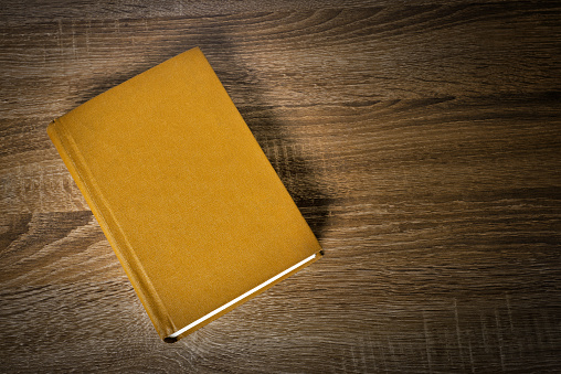 Yellow book on the table