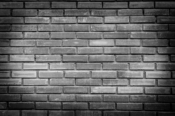 istock Black and white brick wall with black edges. 525225704