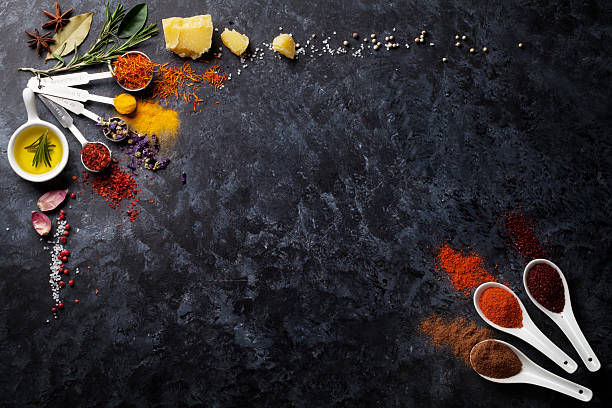 istock Herbs and spices over black stone 525226104