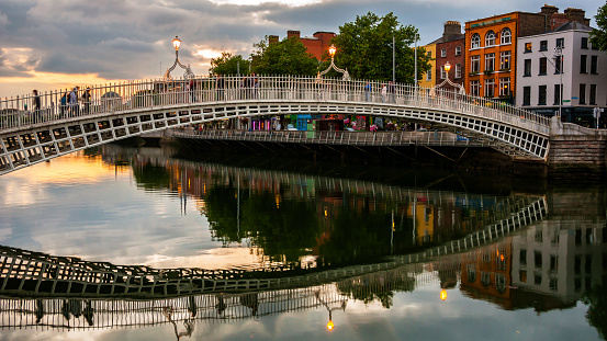 Evening view of famous Ha Penny Bridge in Dublin, Ireland