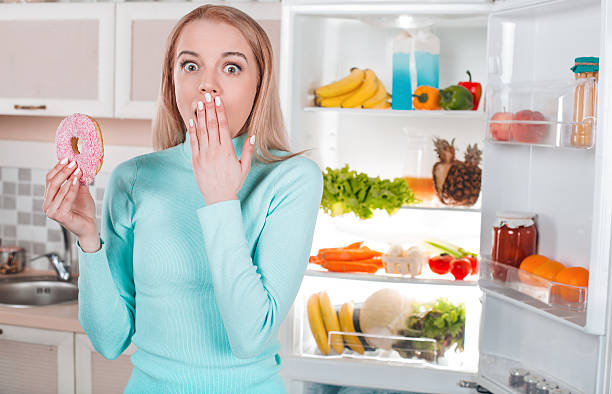 istock Young blonde at home near fridge 525226226