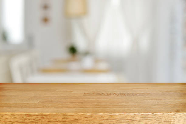 istock Wooden table and blurred dining room 525229714