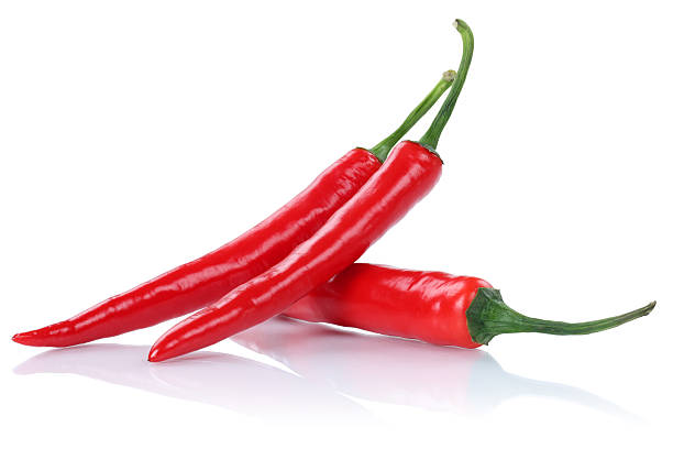 istock Red hot chili peppers pepper isolated on white 525229896