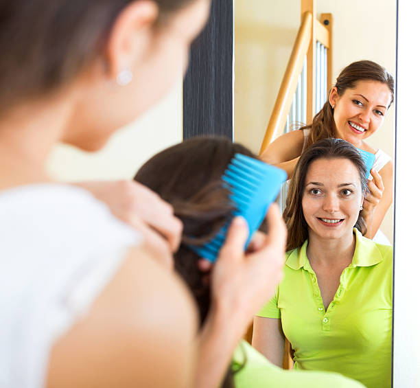 istock Young smiling girl doing hairstyle 525230222
