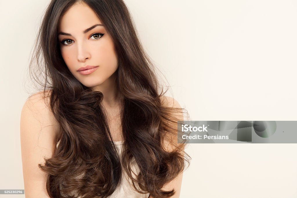 beauty and hairstyle beautiful brunette woman with long healthy hair, studio white Fashion Model Stock Photo