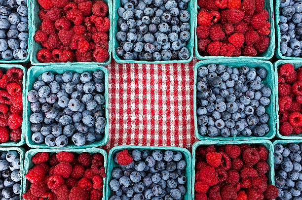 Blueberries and Raspberries for sale stock photo
