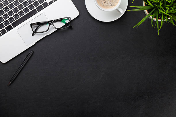 istock Office desk with laptop, coffee, plant 525231892