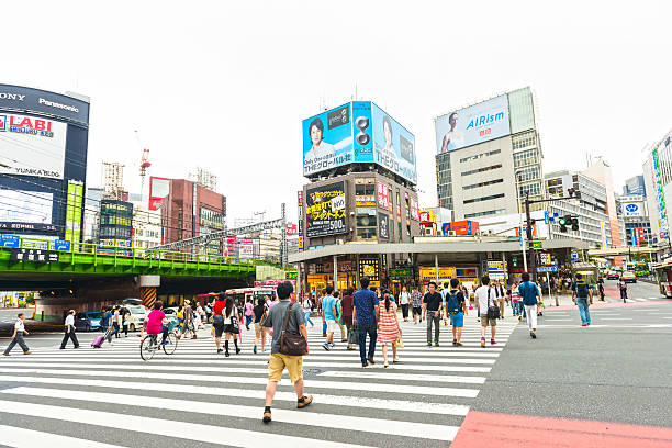istock People crossing street in Tokyo 525234784