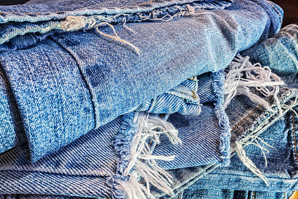 istock Recycled Heap Of Ragged Old Blue Jeans 525234882