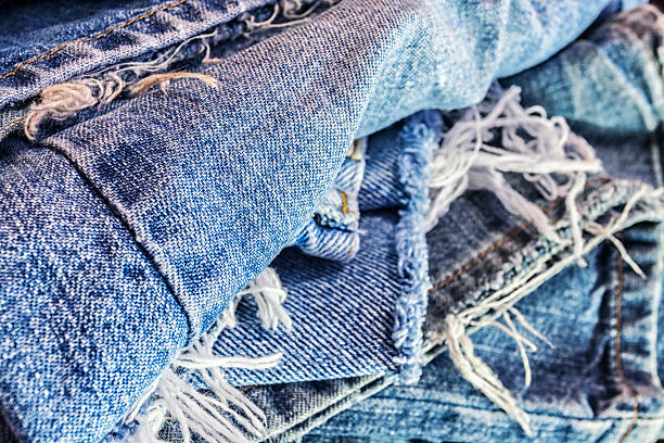 istock Recycled Heap Of Old Ragged Blue Jeans 525234944