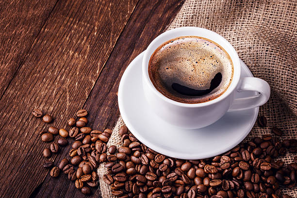 istock Coffee cup and saucer on a wooden table 525235608