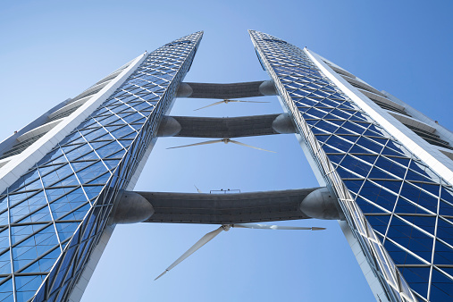 Manama, Bahrain - November 21, 2014: Bahrain World Trade Center. This is a 240-meter-high, 50-floor, twin tower complex. Was built in 2008, first skyscraper in the world with integrated wind turbines
