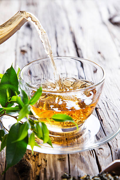 istock Transparent cup of green tea 525241319