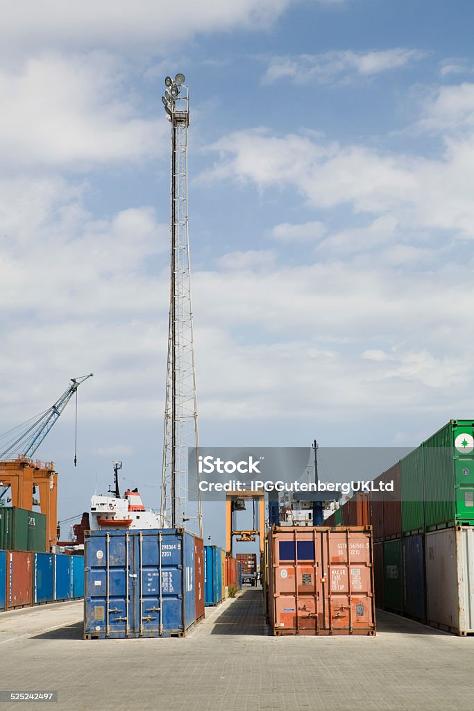 Stacked Containers In Stockyard View of stacked containers against sky in stockyard Accuracy Stock Photo