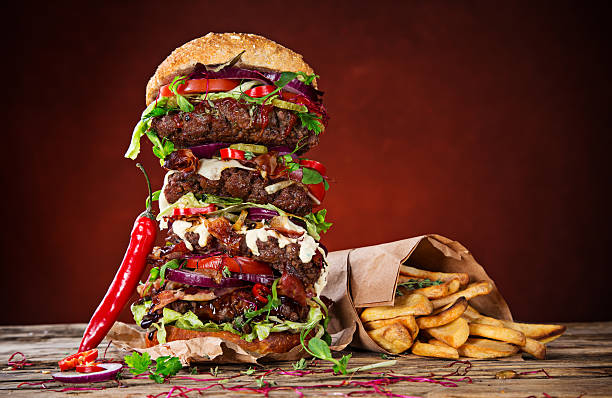 istock delicious big hamburger on wood 525244269