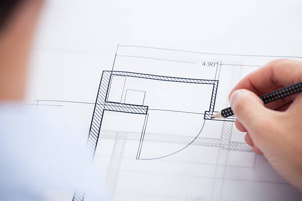 istock Cropped Image Of Architect Working On Blueprint 525245079