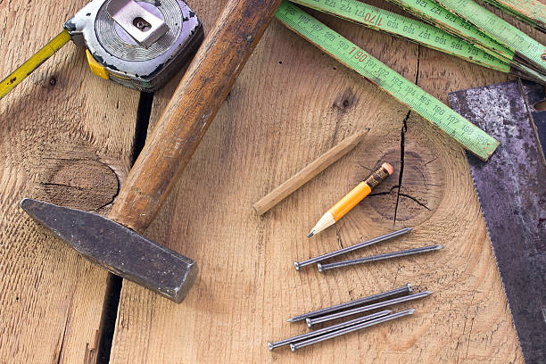 istock Old used carpentry tools on wooden background 525245389