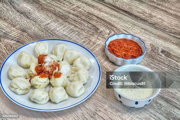 Culurgiones With Tomato Sauce And Parmesan Stock Photo - Download Image Now - Blue, Bowl, Brown