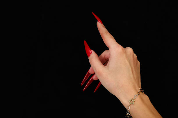 istock Beautiful hands with french manicure on black background 525258513