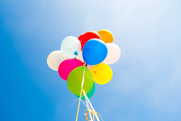 istock Bunch of colorful balloons in  sky 525259791