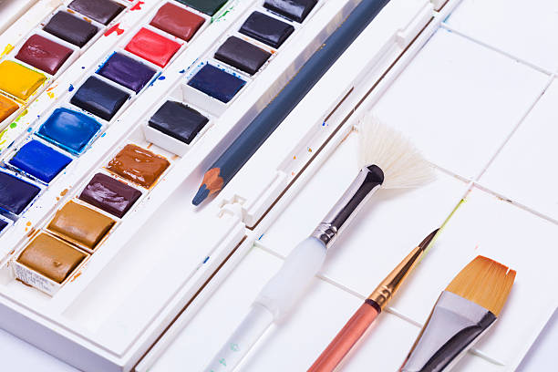 istock Artists watercolour paints and paint brush 525260645