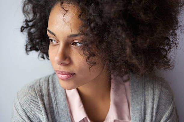 One attractive african american woman Close up portrait of one attractive african american woman sideways glance stock pictures, royalty-free photos & images