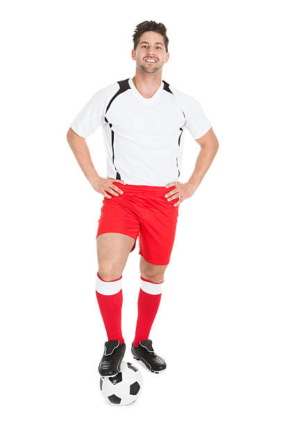 istock Confident Player With Leg On Soccer Ball 525261425