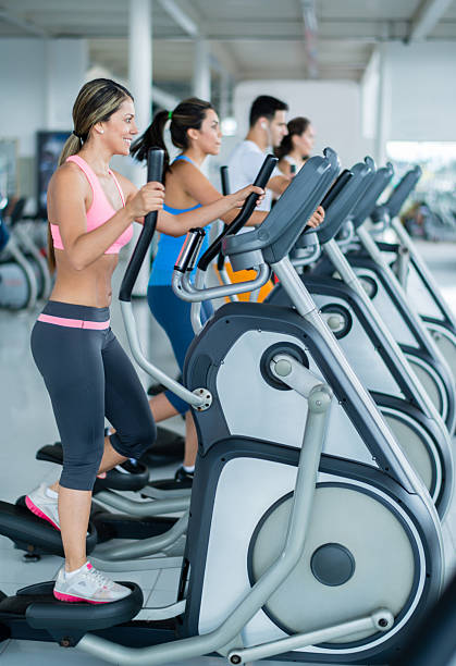 istock Gym people on cross trainers 525261747