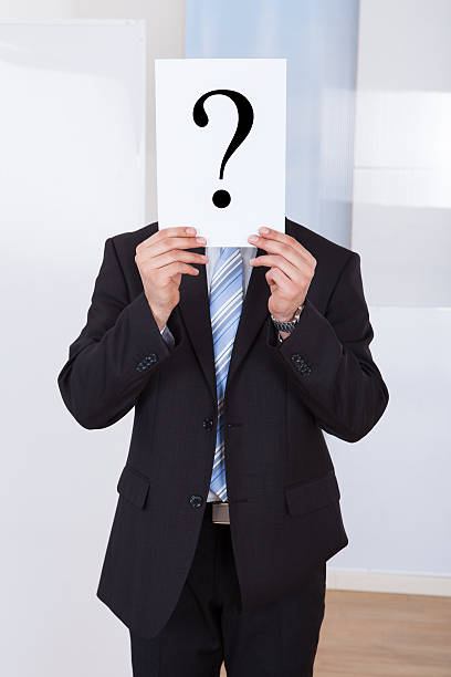 istock Businessman Holding Paper With Question Mark 525261857