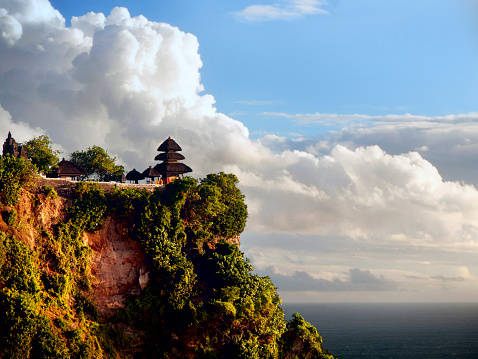 The most famous tourism view of Uluwatu Temple against the clouds.