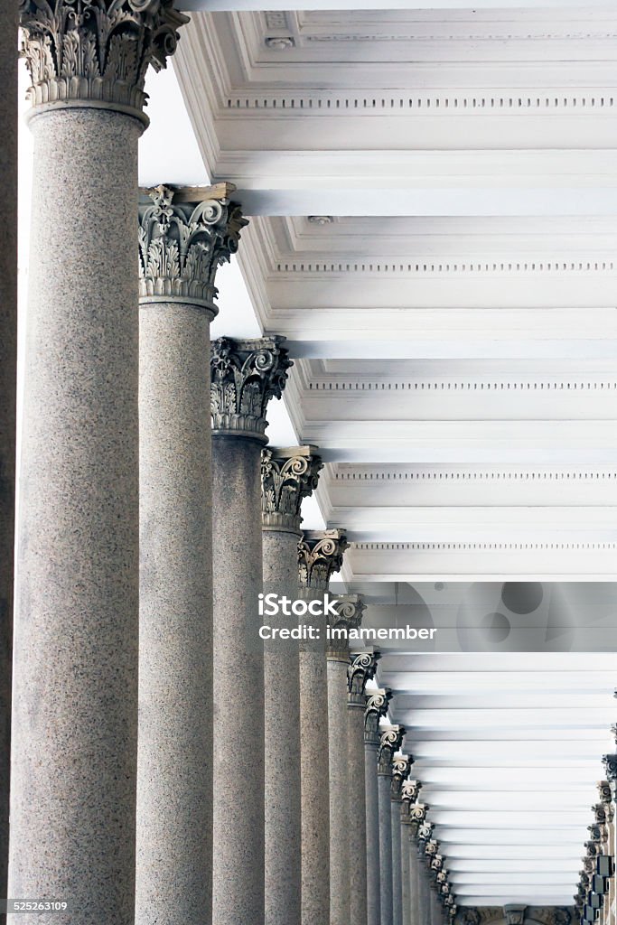Row of classical stone columns Row of classical stone columns in colonnade, full frame vertical composition Security Stock Photo
